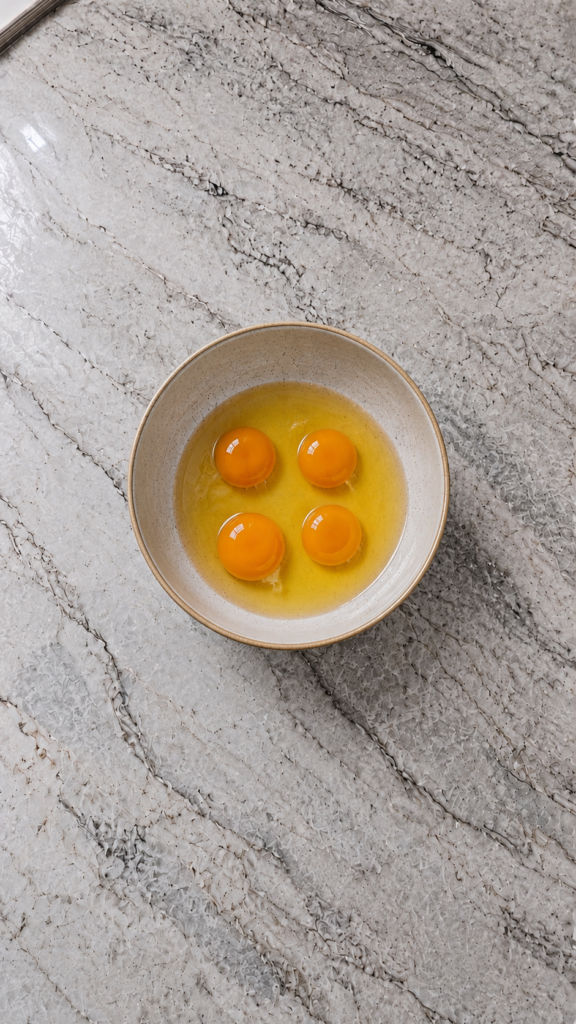 starbucks copycat high protein egg bites on a ceramic plate with fork and linen napkin on marble