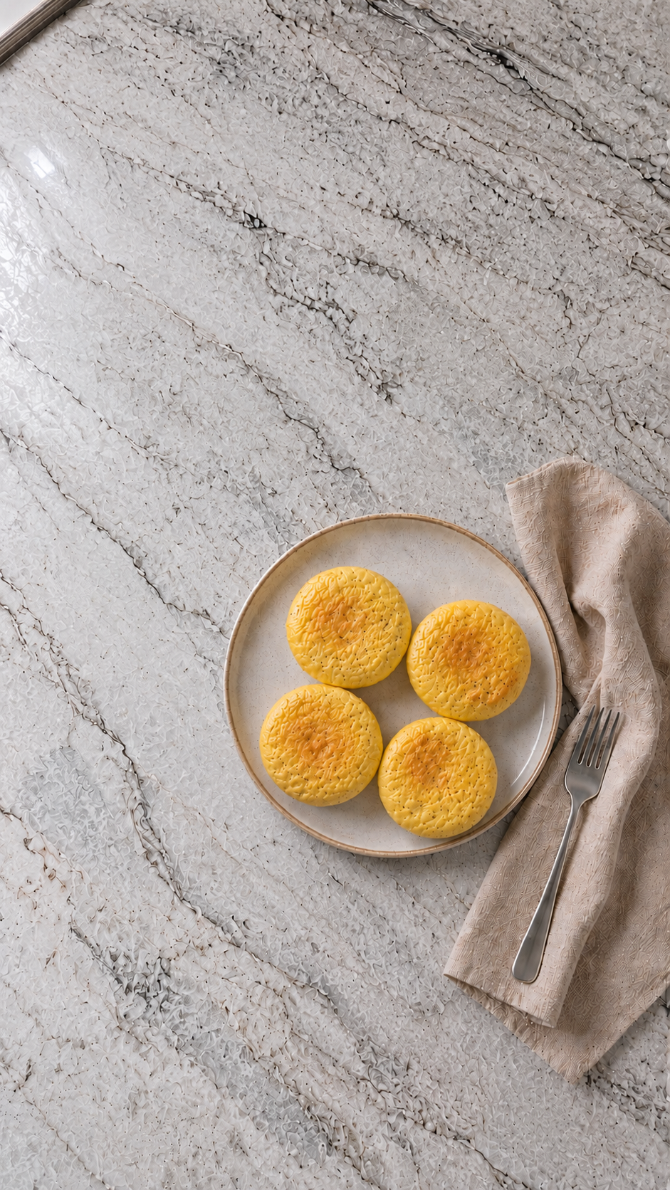 Starbucks Copycat High Protein Egg Bites starbucks copycat high protein egg bites on a ceramic plate with fork and linen napkin on marble countertop